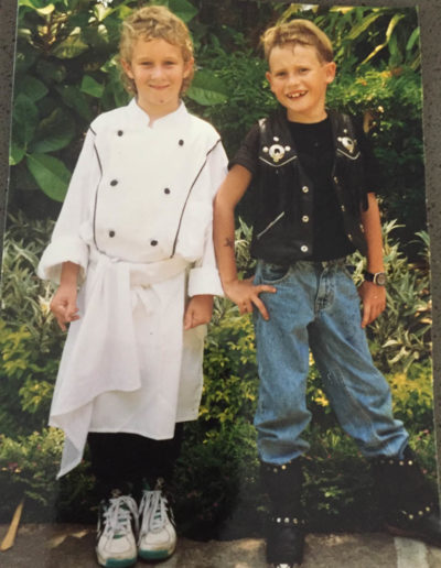 Joel Matthews practicing as chef with his friend